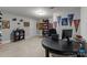 Home office featuring sports memorabilia and dark wood shelving at 327 Wilby Dr, Charlotte, NC 28270