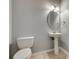 Half-bathroom featuring a pedestal sink, toilet, and tile flooring at 328 Rose Garden Ct, Rock Hill, SC 29732