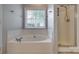 Bright bathroom with a large soaking tub and a separate glass-enclosed shower at 328 Rose Garden Ct, Rock Hill, SC 29732