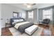 Stylishly furnished bedroom with a ceiling fan, warm wood floors, and neutral walls at 328 Rose Garden Ct, Rock Hill, SC 29732