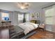 Bright, modern bedroom with wooden floors, natural light, and neutral paint at 328 Rose Garden Ct, Rock Hill, SC 29732