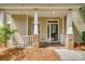 Welcoming entrance with stone-accented columns, tiled floor, and a charming porch at 328 Rose Garden Ct, Rock Hill, SC 29732