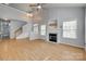 Spacious living room featuring a fireplace, hardwood floors, and lots of natural light at 328 Rose Garden Ct, Rock Hill, SC 29732