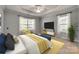 Bright main bedroom featuring a ceiling fan, television and natural light at 328 Rose Garden Ct, Rock Hill, SC 29732