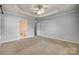 Spacious main bedroom with a tray ceiling and ensuite bathroom at 328 Rose Garden Ct, Rock Hill, SC 29732