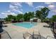 Community pool featuring an umbrella water feature, surrounded by lounge chairs at 328 Rose Garden Ct, Rock Hill, SC 29732
