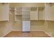 Spacious walk-in closet with custom shelving and drawers for optimal storage solutions at 328 Rose Garden Ct, Rock Hill, SC 29732