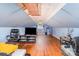 Upstairs bonus room features hardwood floors and sloped ceilings at 3700 Nevin Rd, Charlotte, NC 28269