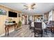 Charming dining room with traditional table and chairs, ceiling fan, and view into other rooms at 3700 Nevin Rd, Charlotte, NC 28269