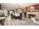 Inviting dining room with fireplace, brick accent wall, and table with seating for six at 3700 Nevin Rd, Charlotte, NC 28269