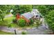 Charming brick home with well-maintained landscaping, a private patio, and a quaint outdoor living space at 3700 Nevin Rd, Charlotte, NC 28269