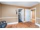 Bright hallway with hardwood floors leading to multiple rooms, offering convenient access at 3700 Nevin Rd, Charlotte, NC 28269