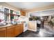Functional kitchen with wooden cabinets, modern appliances, and view into adjoining dining area at 3700 Nevin Rd, Charlotte, NC 28269