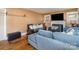 Inviting living room with couches, hardwood floors, fireplace, and TV for relaxing or entertaining at 3700 Nevin Rd, Charlotte, NC 28269