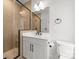 Chic bathroom with a glass-enclosed shower, a single sink vanity, and black hardware accents at 4011 Tundra Rd, Charlotte, NC 28203