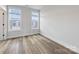 This bedroom has two large windows and hard wood flooring at 4011 Tundra Rd, Charlotte, NC 28203