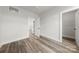 Bright bedroom with wood flooring, open doors and closet, offering style and convenience at 4011 Tundra Rd, Charlotte, NC 28203