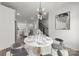 Spacious dining room featuring a round marble table, stylish chairs, and modern chandelier at 4011 Tundra Rd, Charlotte, NC 28203