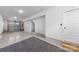 This is a garage with a two car door and a side entrance door at 4011 Tundra Rd, Charlotte, NC 28203