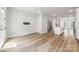 Open floor plan into a kitchen, with hardwood flooring and neutral paint at 4011 Tundra Rd, Charlotte, NC 28203