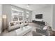 Contemporary living room with large windows, stylish furniture, and modern decor at 4011 Tundra Rd, Charlotte, NC 28203