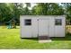Spacious backyard shed with a ramp for easy access and a view of the playground at 407 Orchard Ln, Belmont, NC 28012