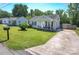 Charming home with well-maintained front yard, a long driveway, and inviting curb appeal at 407 Orchard Ln, Belmont, NC 28012