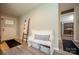 Welcoming hallway featuring a decorative bench, ladder, and stylish gray flooring at 407 Orchard Ln, Belmont, NC 28012