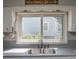 Kitchen window view with a double sink and neutral countertops at 407 Orchard Ln, Belmont, NC 28012