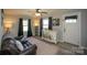 Inviting living room with a leather recliner, decorative cabinet, and natural light at 407 Orchard Ln, Belmont, NC 28012
