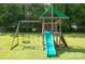 wooden playset that includes a slide, swings, climbing area, basketball hoop, and green canopy at 407 Orchard Ln, Belmont, NC 28012