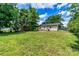 Expansive backyard featuring a lawn, patio, and mature trees at 413 Picadilly Ln, Troutman, NC 28166