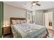 Bedroom featuring a bed with a quilt, natural light, and wood-look flooring at 413 Picadilly Ln, Troutman, NC 28166