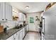 Updated kitchen with white cabinets, granite countertops, subway tile backsplash, and stainless steel appliances at 413 Picadilly Ln, Troutman, NC 28166