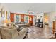 Spacious living room with an accent wall, large sectional sofa, and wood-look flooring at 413 Picadilly Ln, Troutman, NC 28166