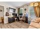 Inviting living room with mounted TV, desk, and water cooler at 413 Picadilly Ln, Troutman, NC 28166