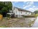 Quaint home featuring a backyard with parking, covered parking, and a chain-link fence at 417 S Broad St, Gastonia, NC 28052