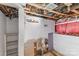 Unfinished basement view showing insulation, plumbing and a light fixture at 417 S Broad St, Gastonia, NC 28052