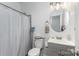 A full bathroom with white sink vanity, toilet and bathtub at 417 S Broad St, Gastonia, NC 28052
