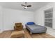 Neutral bedroom with ceiling fan, sleek floors, chair and a single bed at 417 S Broad St, Gastonia, NC 28052
