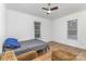 Bright bedroom with sleek floors, ceiling fan, and plenty of natural light at 417 S Broad St, Gastonia, NC 28052