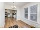 Dining area showcasing hardwood floors and kitchen access at 417 S Broad St, Gastonia, NC 28052