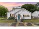Charming exterior of home with white siding, blue front door, and fenced yard at 417 S Broad St, Gastonia, NC 28052