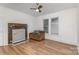 Sunlit living room featuring a rustic fireplace at 417 S Broad St, Gastonia, NC 28052
