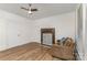 Spacious room with a non-functional fireplace and lots of light at 417 S Broad St, Gastonia, NC 28052
