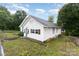 Side view of the house showcasing the white siding and fenced yard at 417 S Broad St, Gastonia, NC 28052