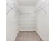 Walk-in closet with carpeted floor and white wire shelving at 4213 Coulter Xing, Charlotte, NC 28213