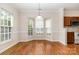 Bright dining area featuring hardwood floors, ample natural light, and kitchen access at 4213 Coulter Xing, Charlotte, NC 28213