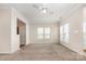 Open living room featuring carpet, neutral walls, lots of natural light, and ceiling fan at 4213 Coulter Xing, Charlotte, NC 28213
