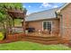 Multi-level wooden deck features a pergola, fire pit, and access to the backyard at 4336 Hunter Rhyne Rd # 9, Lincolnton, NC 28092